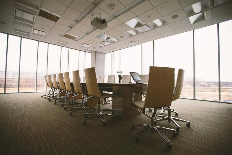 A boardroom conference table in a corporate office